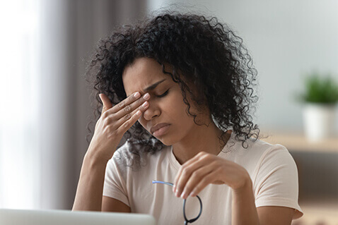 Woman with Dry Eye in home office
